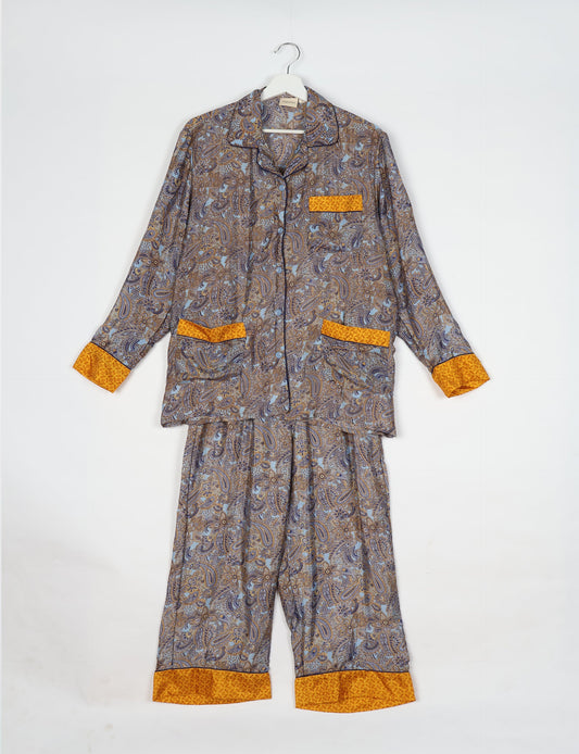 Chic long-sleeve pajama set made from recycled materials, representing eco friendly products, repurposed clothing, and zero waste clothing in green fashion.