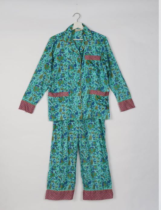 Choose sustainable sleepwear with our PJ SET – perfect for conscious living. From chilling to entertaining, these day-to-night pajamas feature an ethically crafted long-sleeve button-down and elastic-waist pants. Elevate your sleepwear with eco-friendly elegance.