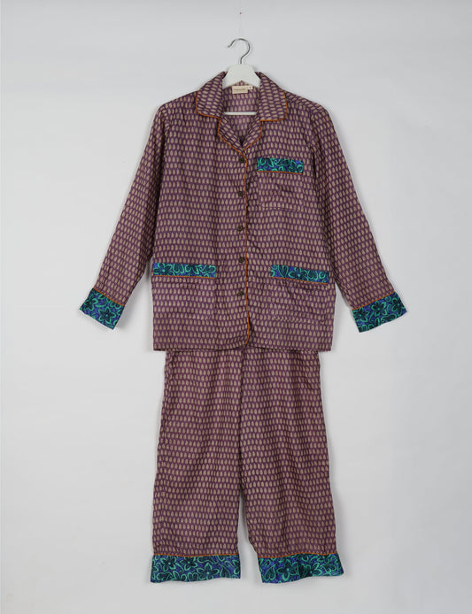 Choose sustainable sleepwear with our PJ SET – perfect for conscious living. From chilling to entertaining, these day-to-night pajamas feature an ethically crafted long-sleeve button-down and elastic-waist pants. Elevate your sleepwear with eco-friendly elegance.