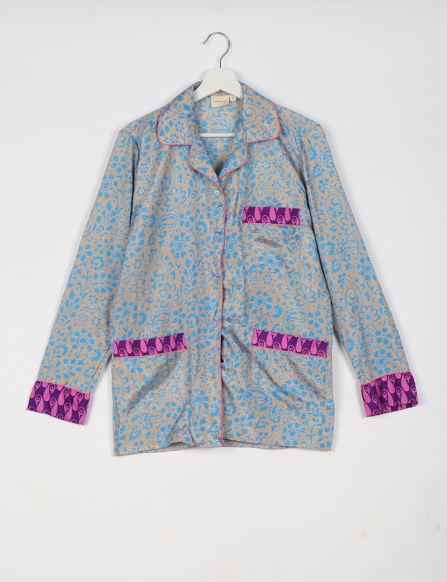 Choose sustainable sleepwear with our PJ SET – perfect for conscious living. From chilling to entertaining, these day-to-night pajamas feature an ethically crafted long-sleeve button-down and elastic-waist pants. Elevate your sleepwear with eco-friendly elegance.