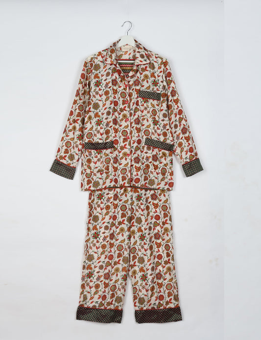 Choose sustainable sleepwear with our PJ SET – perfect for conscious living. From chilling to entertaining, these day-to-night pajamas feature an ethically crafted long-sleeve button-down and elastic-waist pants. Elevate your sleepwear with eco-friendly elegance.