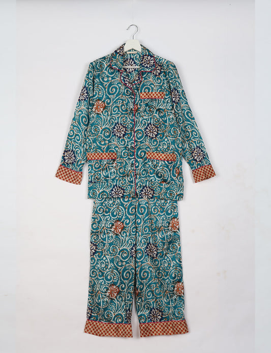 Choose sustainable sleepwear with our PJ SET – perfect for conscious living. From chilling to entertaining, these day-to-night pajamas feature an ethically crafted long-sleeve button-down and elastic-waist pants. Elevate your sleepwear with eco-friendly elegance.