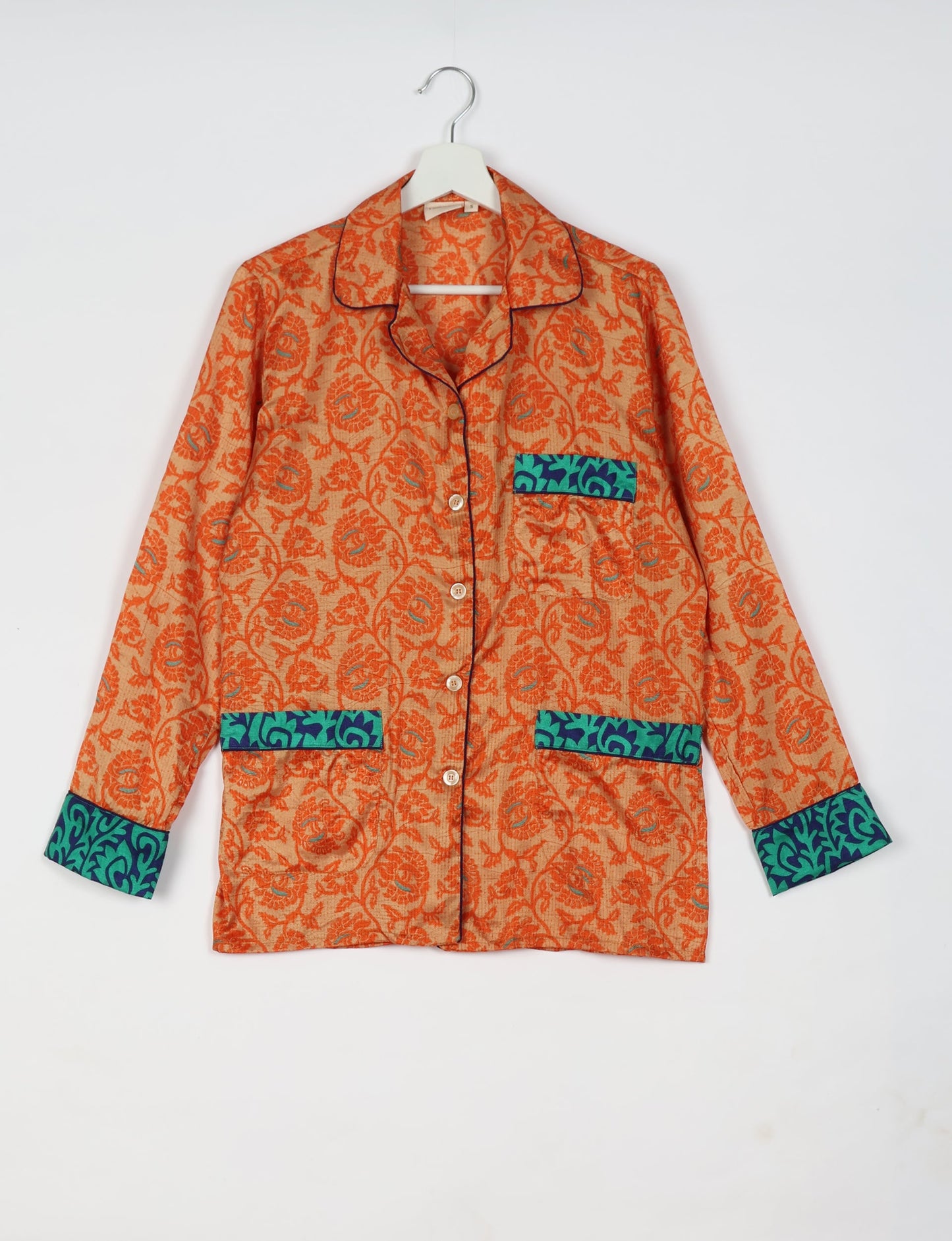 Choose sustainable sleepwear with our PJ SET – perfect for conscious living. From chilling to entertaining, these day-to-night pajamas feature an ethically crafted long-sleeve button-down and elastic-waist pants. Elevate your sleepwear with eco-friendly elegance.