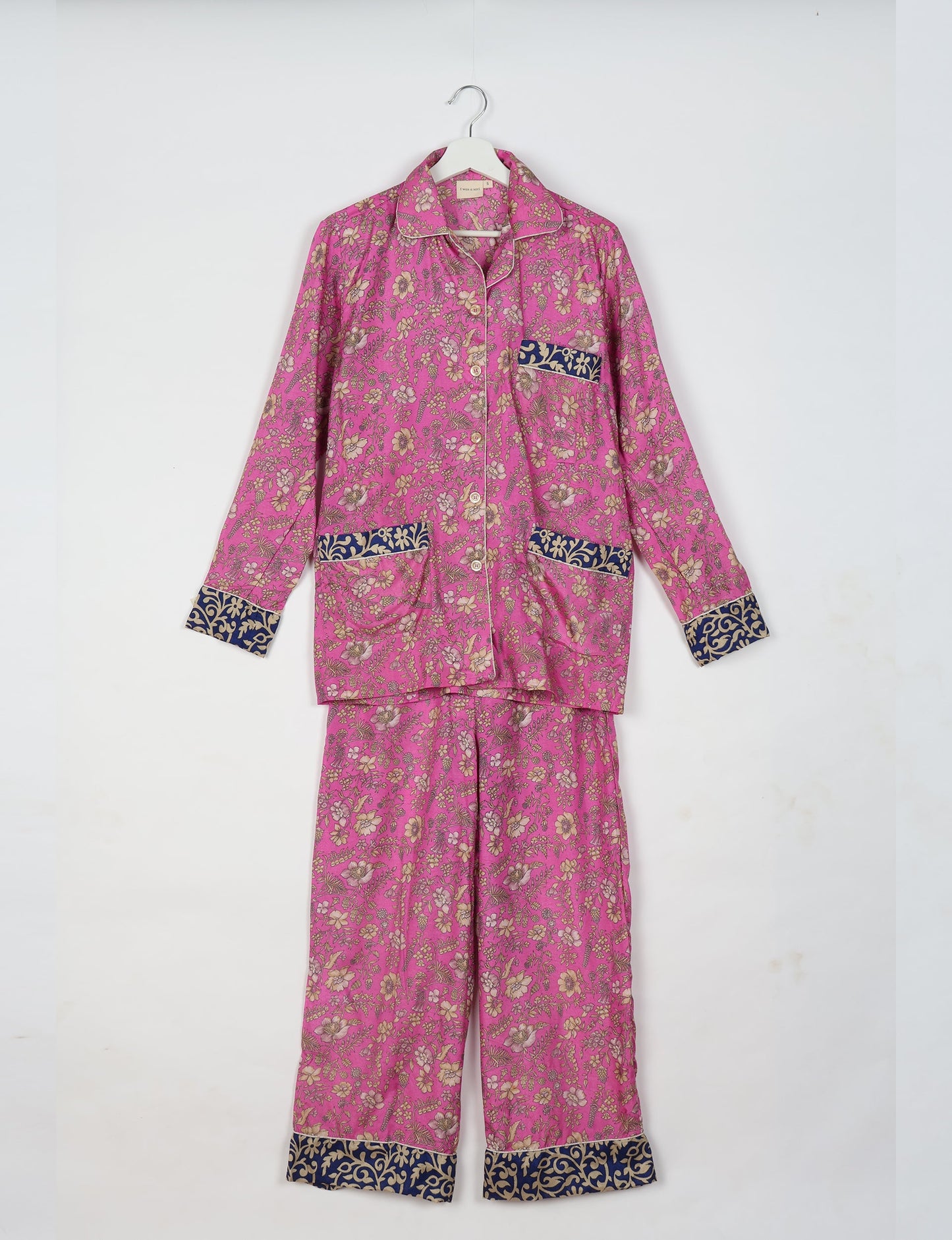 Choose sustainable sleepwear with our PJ SET – perfect for conscious living. From chilling to entertaining, these day-to-night pajamas feature an ethically crafted long-sleeve button-down and elastic-waist pants. Elevate your sleepwear with eco-friendly elegance.