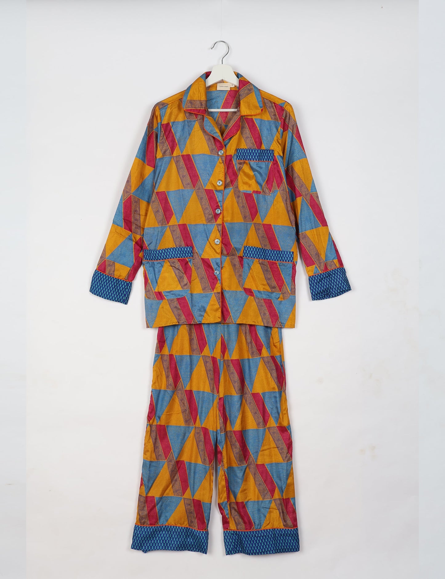 Choose sustainable sleepwear with our PJ SET – perfect for conscious living. From chilling to entertaining, these day-to-night pajamas feature an ethically crafted long-sleeve button-down and elastic-waist pants. Elevate your sleepwear with eco-friendly elegance.