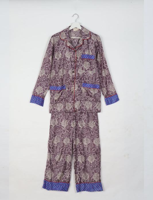 Choose sustainable sleepwear with our PJ SET – perfect for conscious living. From chilling to entertaining, these day-to-night pajamas feature an ethically crafted long-sleeve button-down and elastic-waist pants. Elevate your sleepwear with eco-friendly elegance.