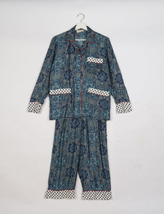 Chic long-sleeve pajama set made from recycled materials, representing eco friendly products, repurposed clothing, and zero waste clothing in green fashion.