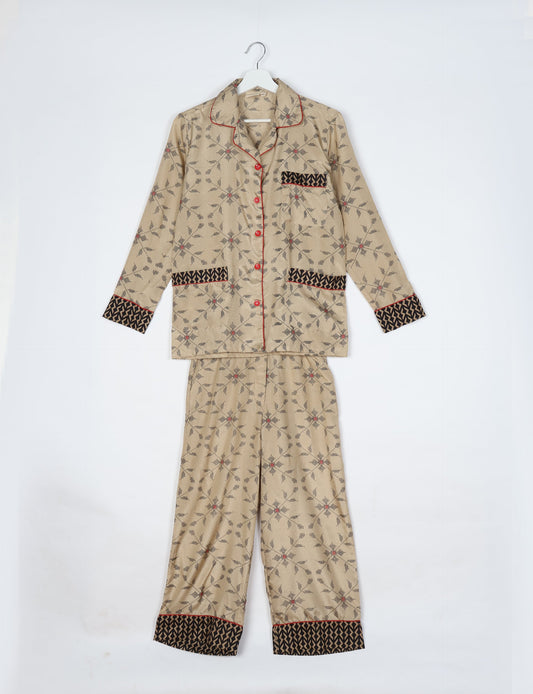 Chic long-sleeve pajama set made from recycled materials, representing eco friendly products, repurposed clothing, and zero waste clothing in green fashion.