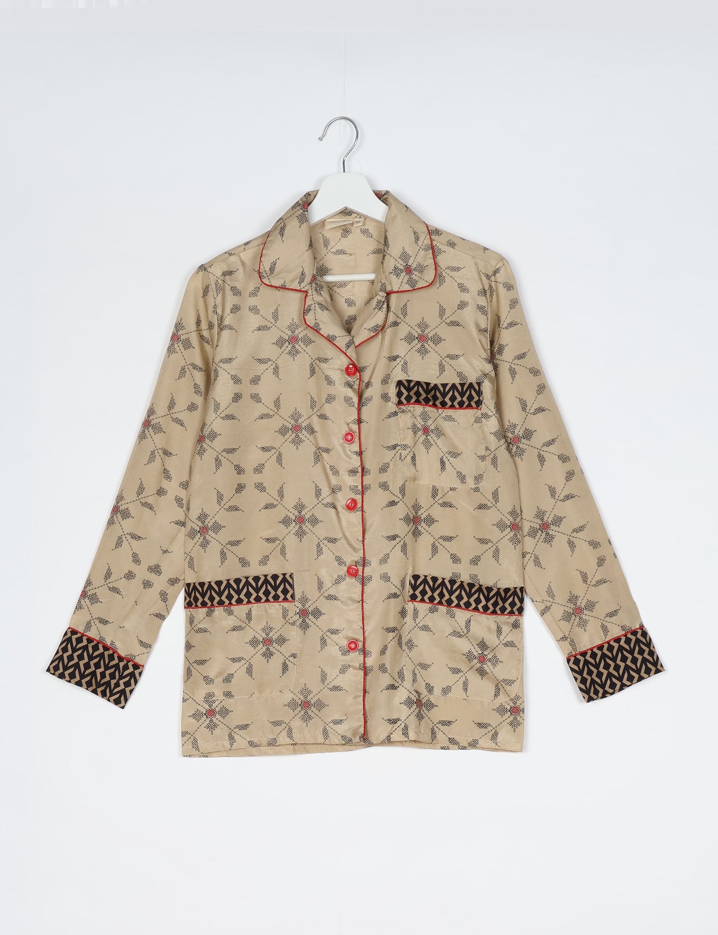 Chic long-sleeve pajama set made from recycled materials, representing eco friendly products, repurposed clothing, and zero waste clothing in green fashion.