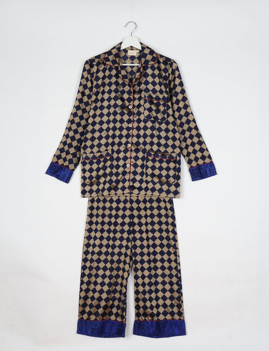Chic long-sleeve pajama set made from recycled materials, representing eco friendly products, repurposed clothing, and zero waste clothing in green fashion.
