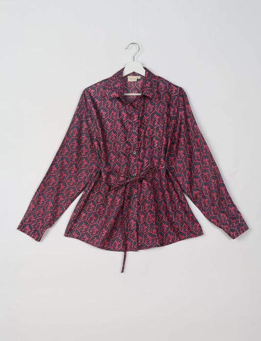 Experience sustainable fashion with our classic slim-fit shirt, crafted with ethical and green values. The shirt, designed for minimal waste, features a tie-up waist belt or neck tie, semi-spread collar, and regular shirt cuffs. Versatile and eco-friendly, wear it tucked in, unbuttoned over a tank top, or knotted at the waist for a unique style.