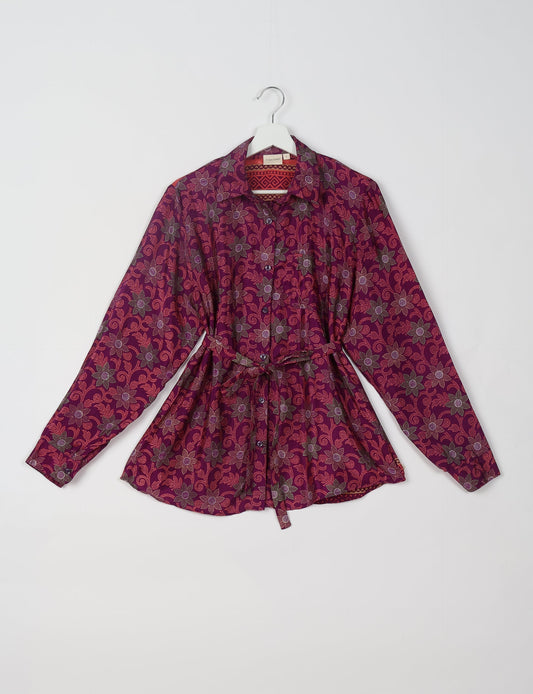 Experience sustainable fashion with our classic slim-fit shirt, crafted with ethical and green values. The shirt, designed for minimal waste, features a tie-up waist belt or neck tie, semi-spread collar, and regular shirt cuffs. Versatile and eco-friendly, wear it tucked in, unbuttoned over a tank top, or knotted at the waist for a unique style.