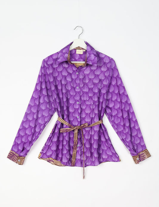 Experience sustainable fashion with our classic slim-fit shirt, crafted with ethical and green values. The shirt, designed for minimal waste, features a tie-up waist belt or neck tie, semi-spread collar, and regular shirt cuffs. Versatile and eco-friendly, wear it tucked in, unbuttoned over a tank top, or knotted at the waist for a unique style.