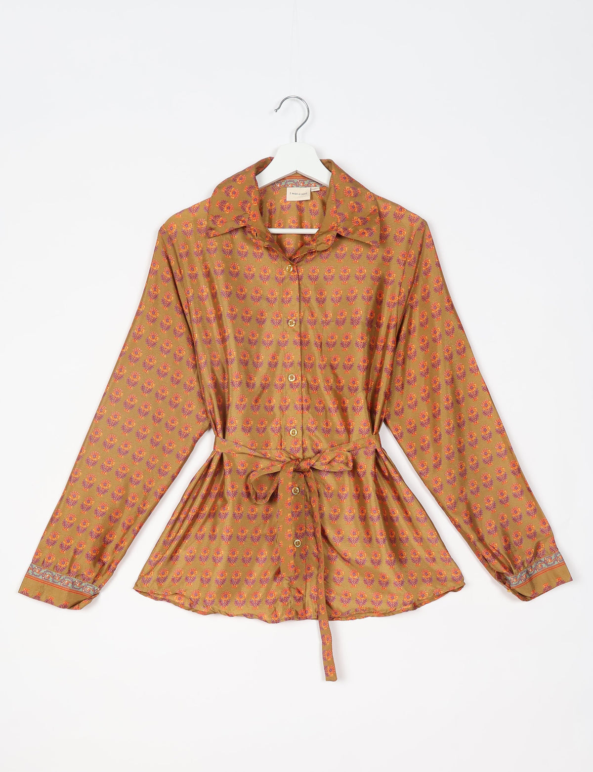 Yellow button-up shirt with micro floral pattern, long sleeves, collar, and waist tie, shown flat on hanger