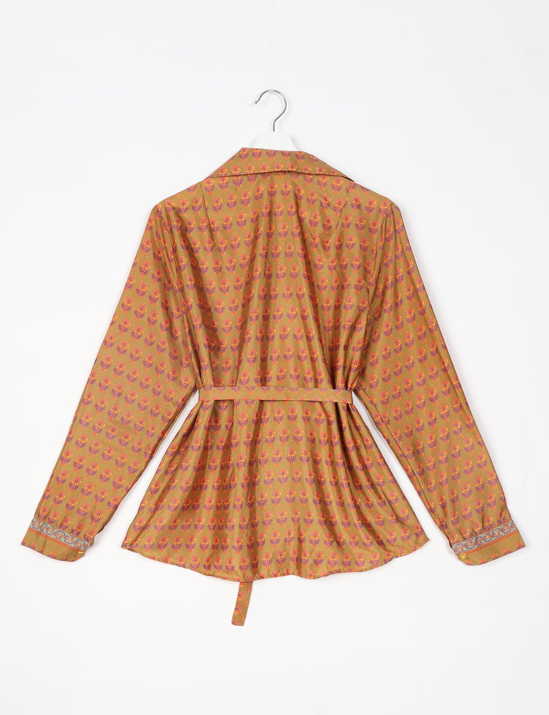 Yellow long-sleeve shirt with orange and purple floral micro design, belted waist, and patterned cuffs, shown from back on hanger