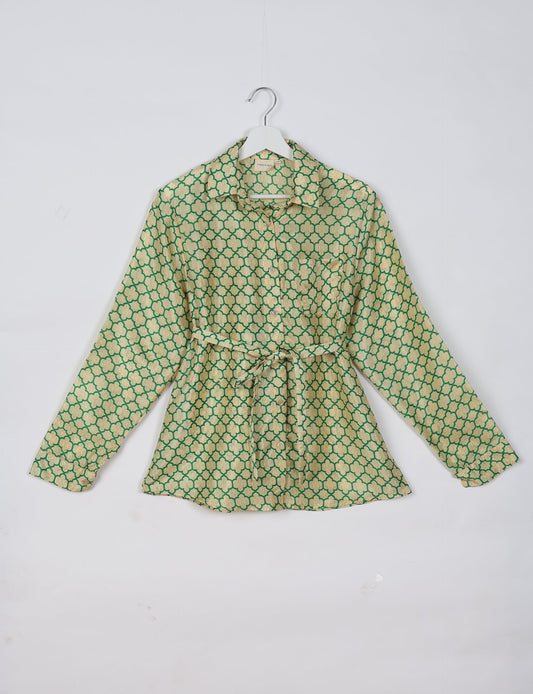 Experience sustainable fashion with our classic slim-fit shirt, crafted with ethical and green values. The shirt, designed for minimal waste, features a tie-up waist belt or neck tie, semi-spread collar, and regular shirt cuffs. Versatile and eco-friendly, wear it tucked in, unbuttoned over a tank top, or knotted at the waist for a unique style.