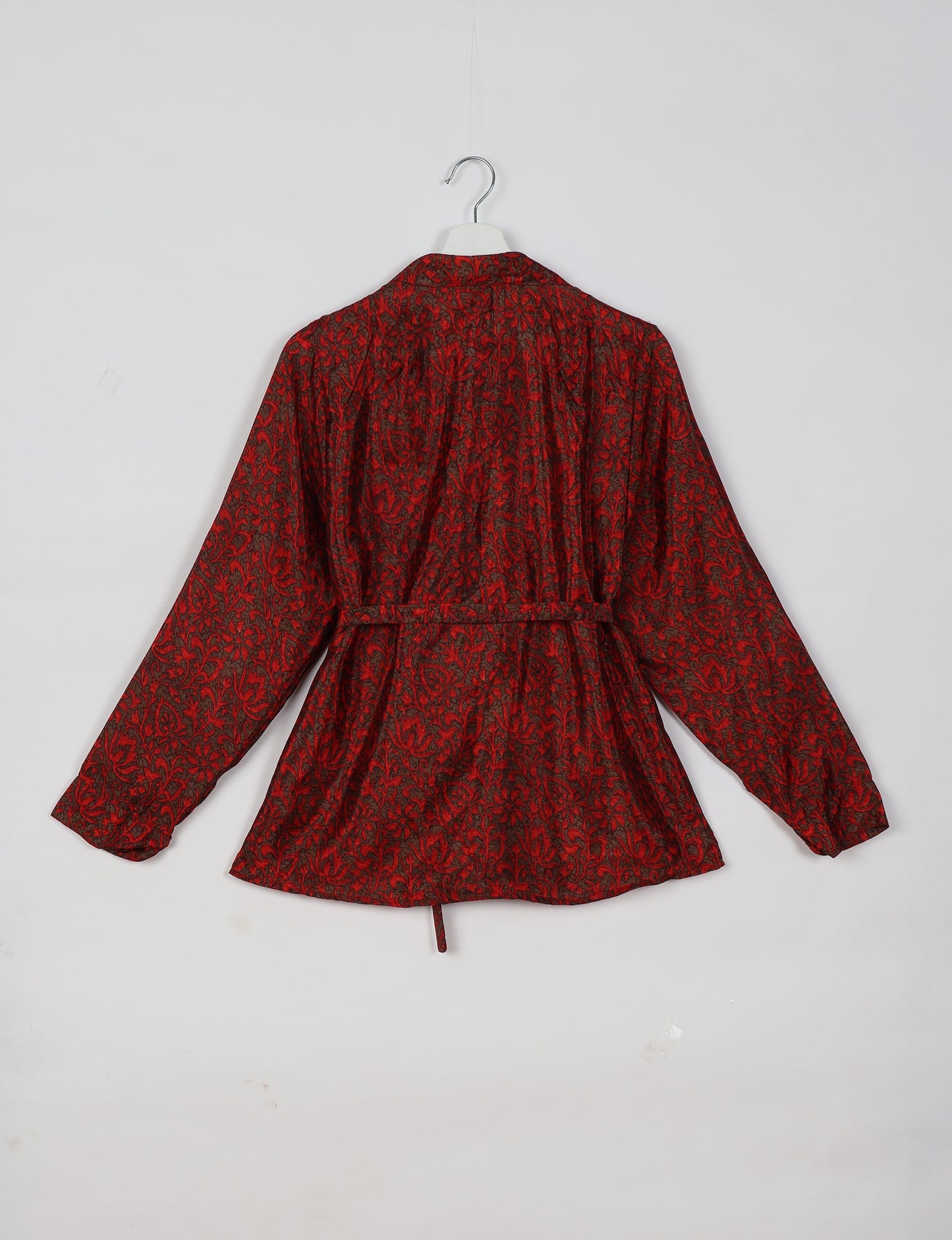 Experience sustainable fashion with our classic slim-fit shirt, crafted with ethical and green values. The shirt, designed for minimal waste, features a tie-up waist belt or neck tie, semi-spread collar, and regular shirt cuffs. Versatile and eco-friendly, wear it tucked in, unbuttoned over a tank top, or knotted at the waist for a unique style.