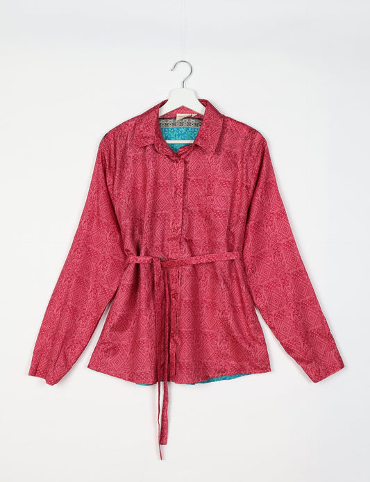 Experience sustainable fashion with our classic slim-fit shirt, crafted with ethical and green values. The shirt, designed for minimal waste, features a tie-up waist belt or neck tie, semi-spread collar, and regular shirt cuffs. Versatile and eco-friendly, wear it tucked in, unbuttoned over a tank top, or knotted at the waist for a unique style.