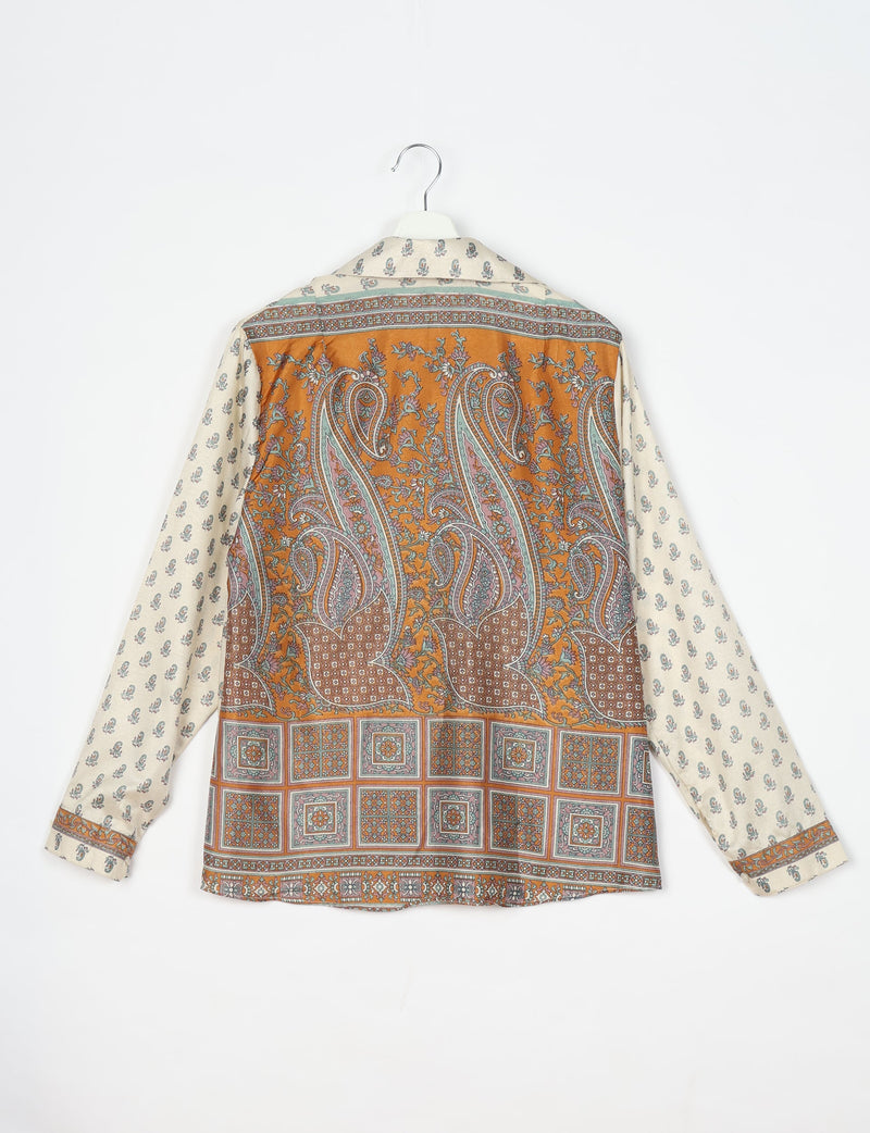 Long-sleeve shirt with cream sleeves and back featuring orange paisley and floral micro design, hanging on white hanger