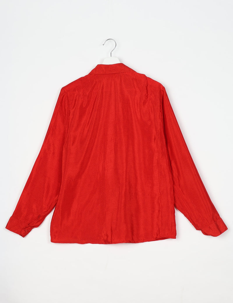 Red long-sleeve shirt with subtle geometric pattern, spread collar, and buttoned cuffs, shown from back on hanger