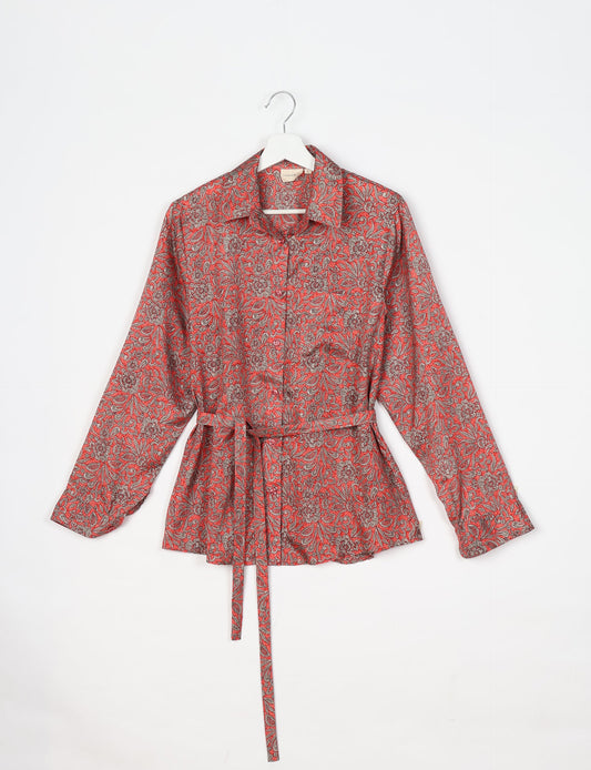 Experience sustainable fashion with our classic slim-fit shirt, crafted with ethical and green values. The shirt, designed for minimal waste, features a tie-up waist belt or neck tie, semi-spread collar, and regular shirt cuffs. Versatile and eco-friendly, wear it tucked in, unbuttoned over a tank top, or knotted at the waist for a unique style.