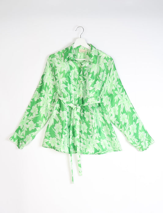 Experience sustainable fashion with our classic slim-fit shirt, crafted with ethical and green values. The shirt, designed for minimal waste, features a tie-up waist belt or neck tie, semi-spread collar, and regular shirt cuffs. Versatile and eco-friendly, wear it tucked in, unbuttoned over a tank top, or knotted at the waist for a unique style.