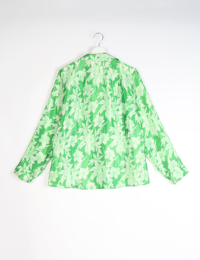 Green long-sleeve shirt with light green leaf pattern, shown from back on white hanger against white background