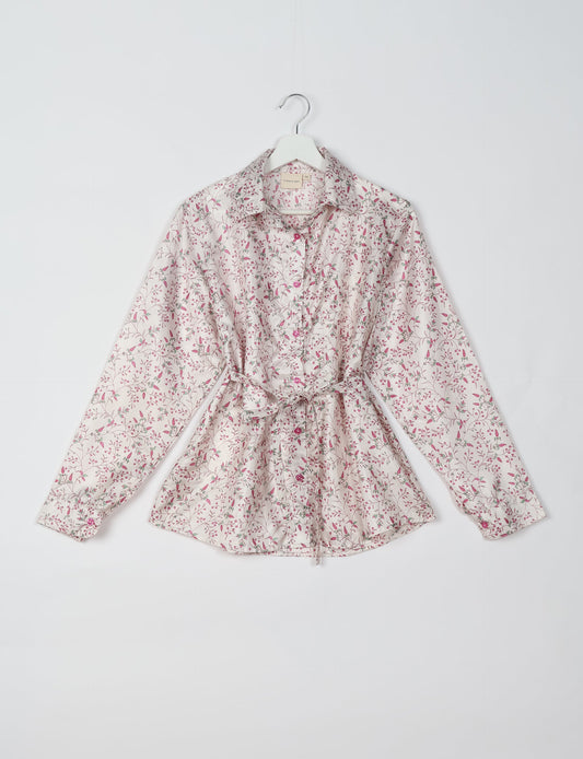 Experience sustainable fashion with our classic slim-fit shirt, crafted with ethical and green values. The shirt, designed for minimal waste, features a tie-up waist belt or neck tie, semi-spread collar, and regular shirt cuffs. Versatile and eco-friendly, wear it tucked in, unbuttoned over a tank top, or knotted at the waist for a unique style.