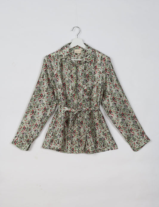 Experience sustainable fashion with our classic slim-fit shirt, crafted with ethical and green values. The shirt, designed for minimal waste, features a tie-up waist belt or neck tie, semi-spread collar, and regular shirt cuffs. Versatile and eco-friendly, wear it tucked in, unbuttoned over a tank top, or knotted at the waist for a unique style.