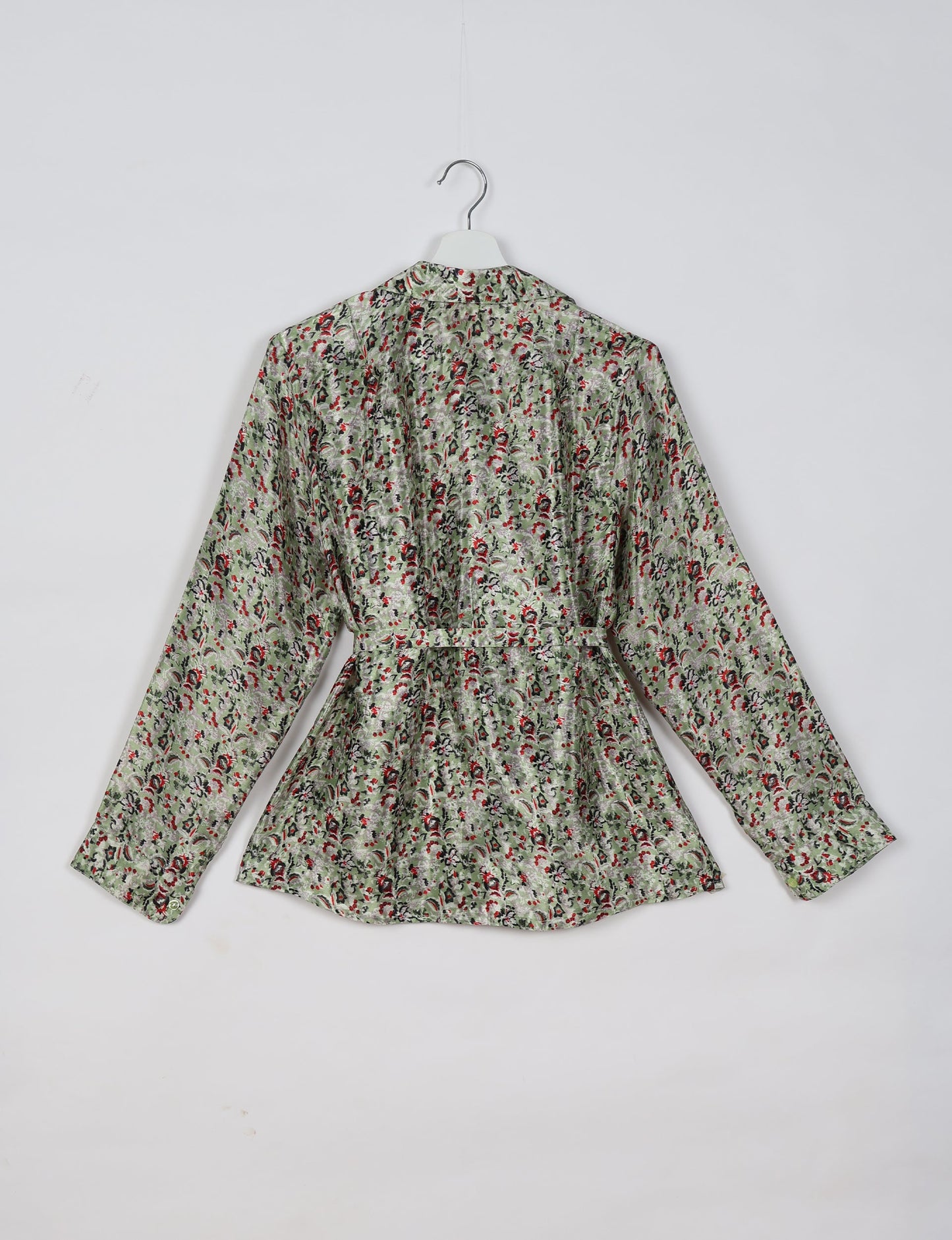 Experience sustainable fashion with our classic slim-fit shirt, crafted with ethical and green values. The shirt, designed for minimal waste, features a tie-up waist belt or neck tie, semi-spread collar, and regular shirt cuffs. Versatile and eco-friendly, wear it tucked in, unbuttoned over a tank top, or knotted at the waist for a unique style.