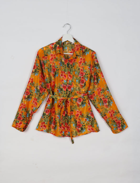 Experience sustainable fashion with our classic slim-fit shirt, crafted with ethical and green values. The shirt, designed for minimal waste, features a tie-up waist belt or neck tie, semi-spread collar, and regular shirt cuffs. Versatile and eco-friendly, wear it tucked in, unbuttoned over a tank top, or knotted at the waist for a unique style.