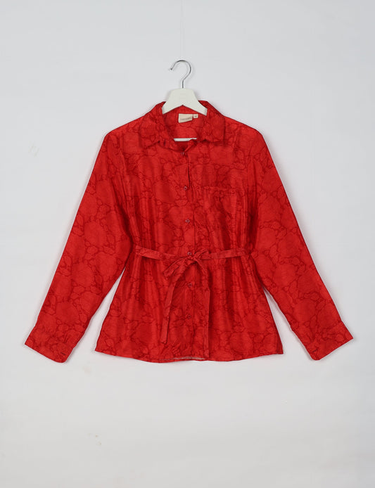 Experience sustainable fashion with our classic slim-fit shirt, crafted with ethical and green values. The shirt, designed for minimal waste, features a tie-up waist belt or neck tie, semi-spread collar, and regular shirt cuffs. Versatile and eco-friendly, wear it tucked in, unbuttoned over a tank top, or knotted at the waist for a unique style.