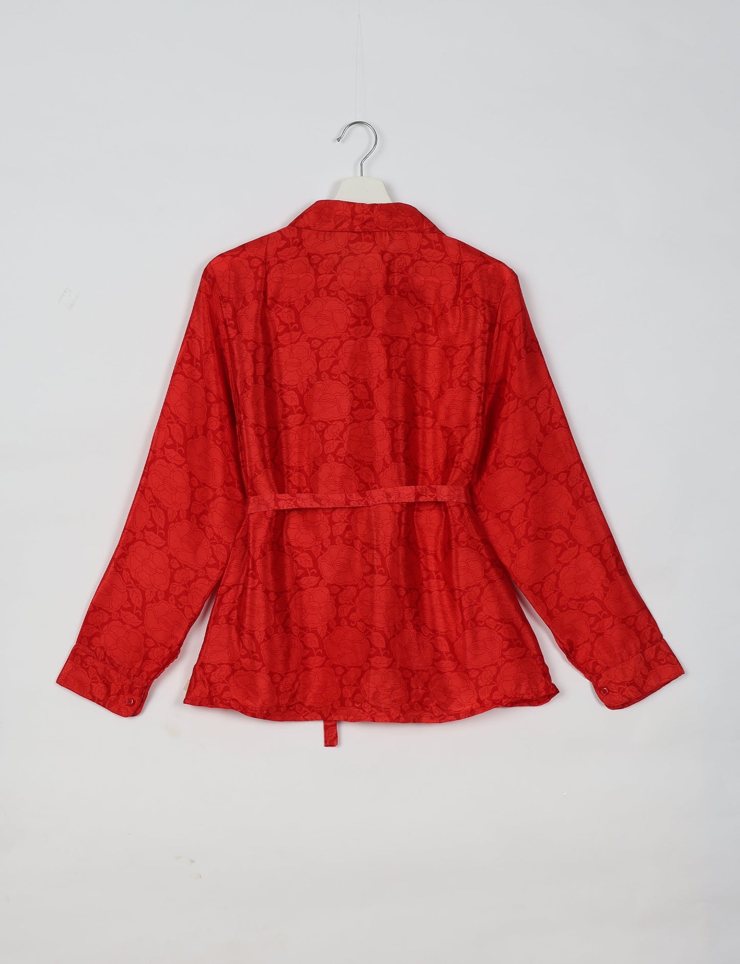 Experience sustainable fashion with our classic slim-fit shirt, crafted with ethical and green values. The shirt, designed for minimal waste, features a tie-up waist belt or neck tie, semi-spread collar, and regular shirt cuffs. Versatile and eco-friendly, wear it tucked in, unbuttoned over a tank top, or knotted at the waist for a unique style.