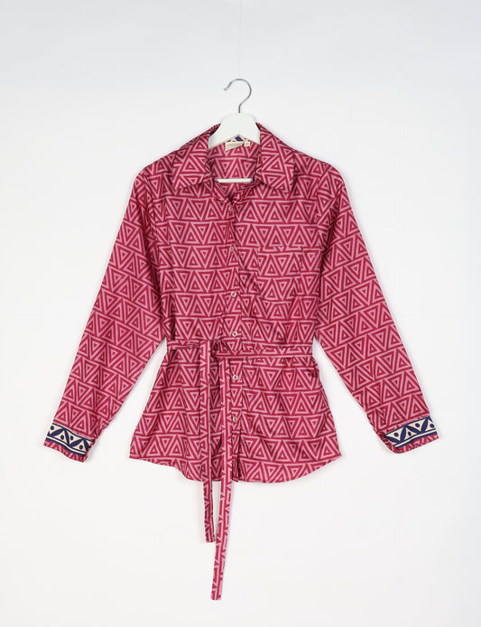 Experience sustainable fashion with our classic slim-fit shirt, crafted with ethical and green values. The shirt, designed for minimal waste, features a tie-up waist belt or neck tie, semi-spread collar, and regular shirt cuffs. Versatile and eco-friendly, wear it tucked in, unbuttoned over a tank top, or knotted at the waist for a unique style.