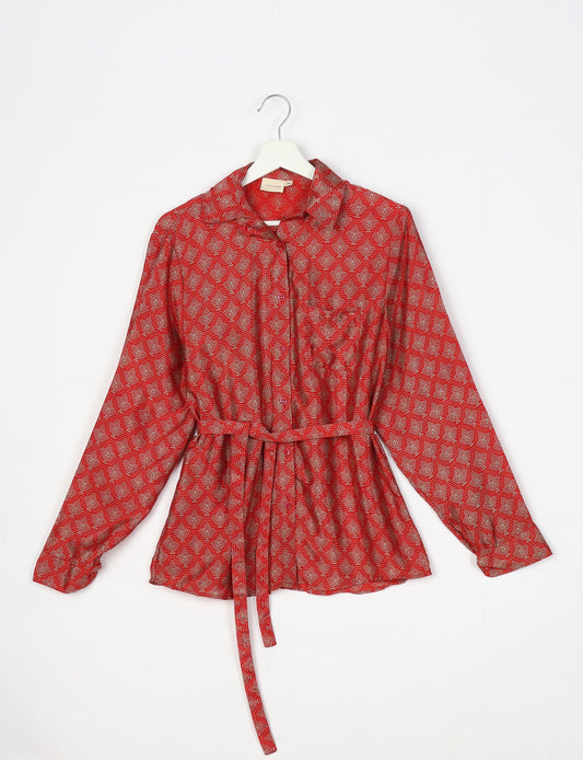 Experience sustainable fashion with our classic slim-fit shirt, crafted with ethical and green values. The shirt, designed for minimal waste, features a tie-up waist belt or neck tie, semi-spread collar, and regular shirt cuffs. Versatile and eco-friendly, wear it tucked in, unbuttoned over a tank top, or knotted at the waist for a unique style.