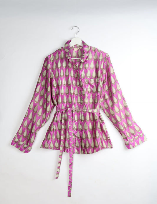 Experience sustainable fashion with our classic slim-fit shirt, crafted with ethical and green values. The shirt, designed for minimal waste, features a tie-up waist belt or neck tie, semi-spread collar, and regular shirt cuffs. Versatile and eco-friendly, wear it tucked in, unbuttoned over a tank top, or knotted at the waist for a unique style.