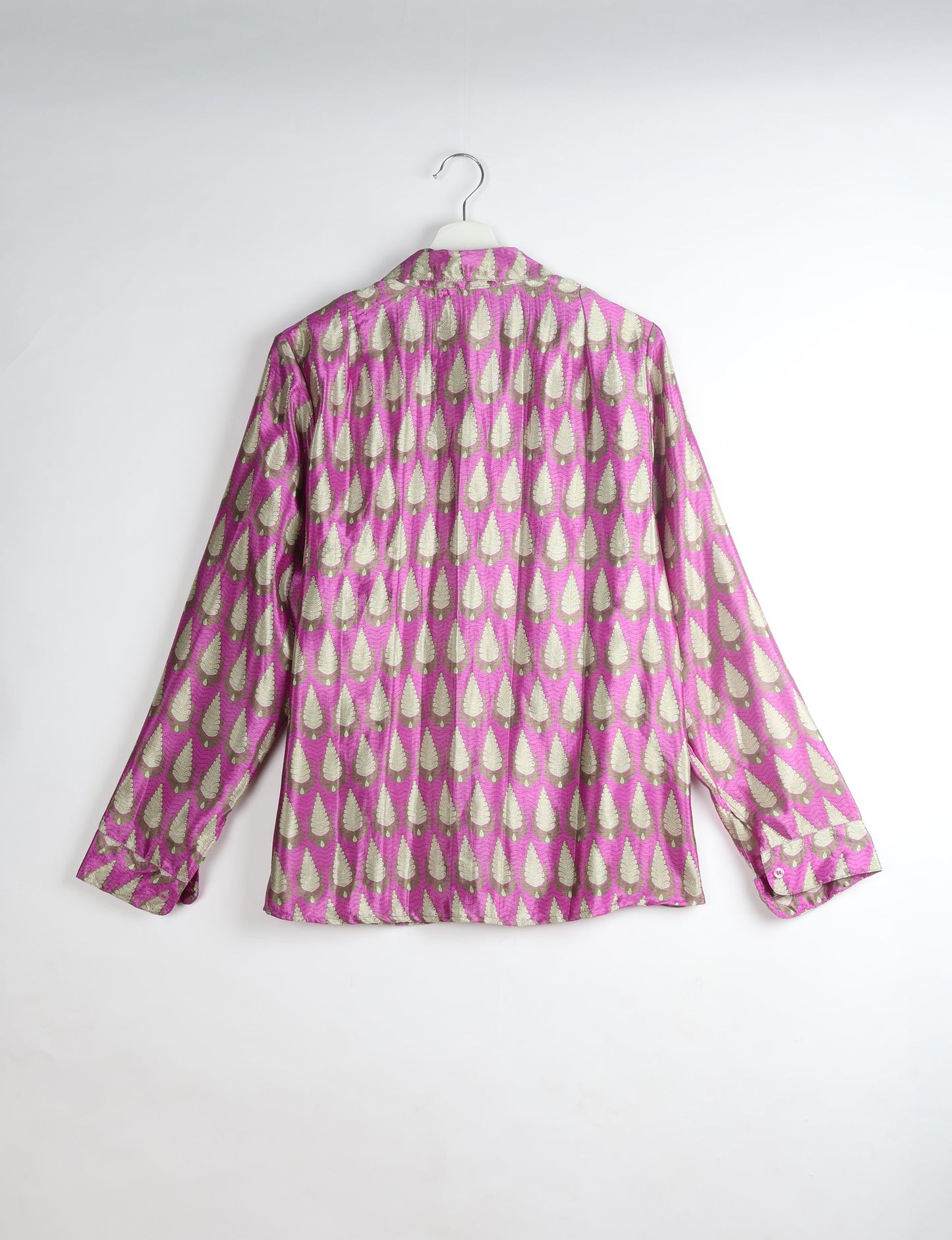 Experience sustainable fashion with our classic slim-fit shirt, crafted with ethical and green values. The shirt, designed for minimal waste, features a tie-up waist belt or neck tie, semi-spread collar, and regular shirt cuffs. Versatile and eco-friendly, wear it tucked in, unbuttoned over a tank top, or knotted at the waist for a unique style.