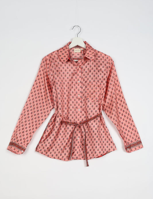 Experience sustainable fashion with our classic slim-fit shirt, crafted with ethical and green values. The shirt, designed for minimal waste, features a tie-up waist belt or neck tie, semi-spread collar, and regular shirt cuffs. Versatile and eco-friendly, wear it tucked in, unbuttoned over a tank top, or knotted at the waist for a unique style.