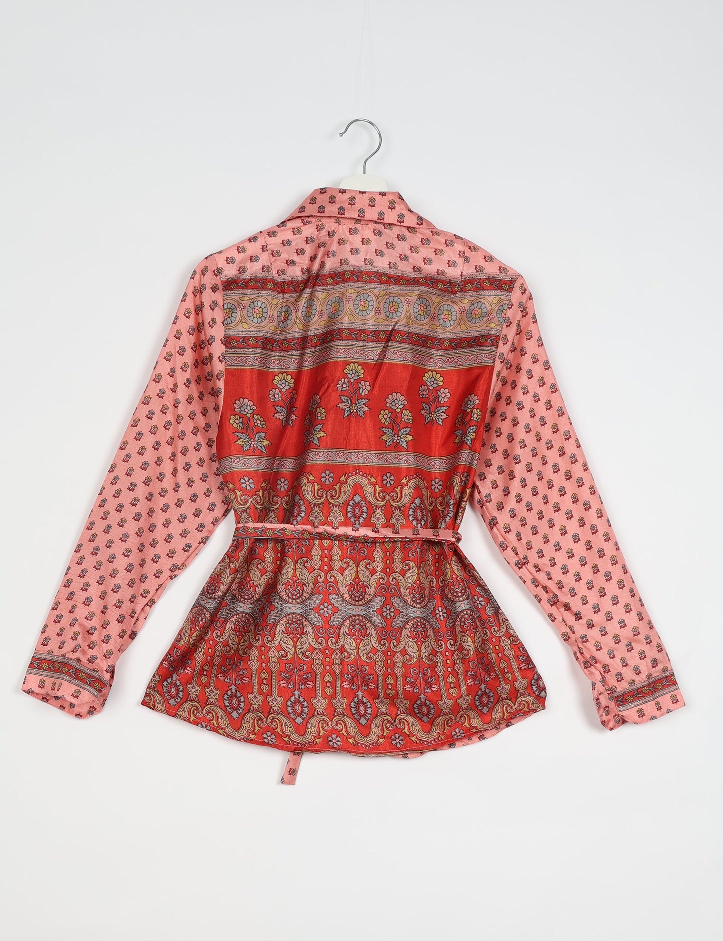 Experience sustainable fashion with our classic slim-fit shirt, crafted with ethical and green values. The shirt, designed for minimal waste, features a tie-up waist belt or neck tie, semi-spread collar, and regular shirt cuffs. Versatile and eco-friendly, wear it tucked in, unbuttoned over a tank top, or knotted at the waist for a unique style.