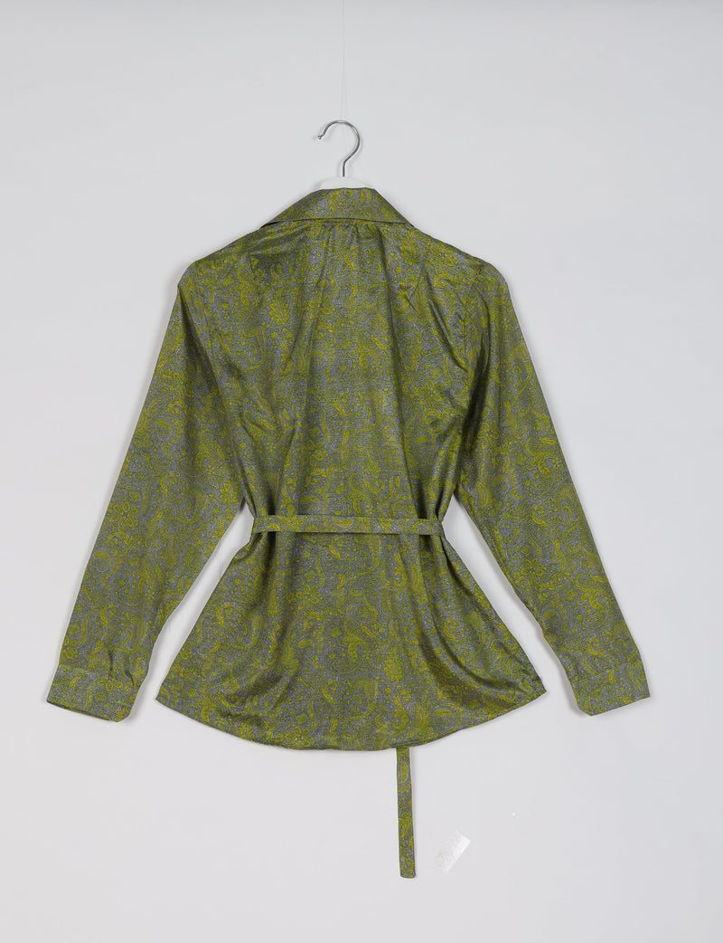 Green and gray paisley patterned long-sleeve shirt with collar and waist tie, shown from back on hanger against white background