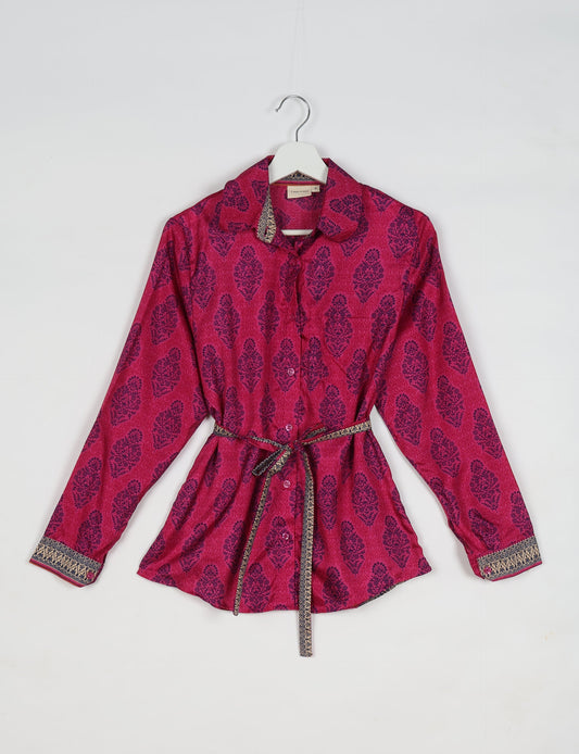 Experience sustainable fashion with our classic slim-fit shirt, crafted with ethical and green values. The shirt, designed for minimal waste, features a tie-up waist belt or neck tie, semi-spread collar, and regular shirt cuffs. Versatile and eco-friendly, wear it tucked in, unbuttoned over a tank top, or knotted at the waist for a unique style.