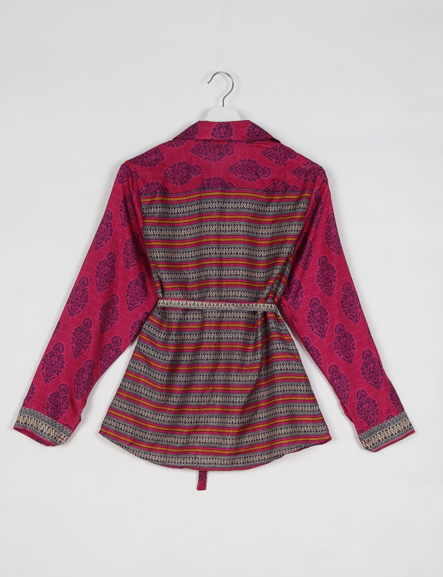 Experience sustainable fashion with our classic slim-fit shirt, crafted with ethical and green values. The shirt, designed for minimal waste, features a tie-up waist belt or neck tie, semi-spread collar, and regular shirt cuffs. Versatile and eco-friendly, wear it tucked in, unbuttoned over a tank top, or knotted at the waist for a unique style.