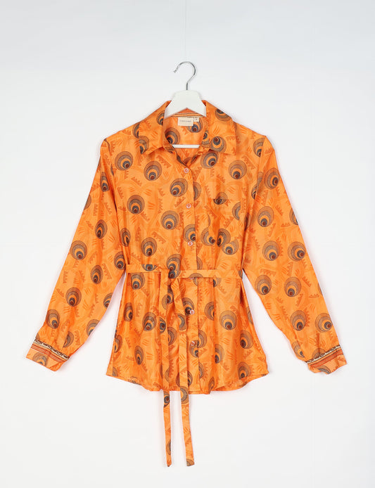 Experience sustainable fashion with our classic slim-fit shirt, crafted with ethical and green values. The shirt, designed for minimal waste, features a tie-up waist belt or neck tie, semi-spread collar, and regular shirt cuffs. Versatile and eco-friendly, wear it tucked in, unbuttoned over a tank top, or knotted at the waist for a unique style.