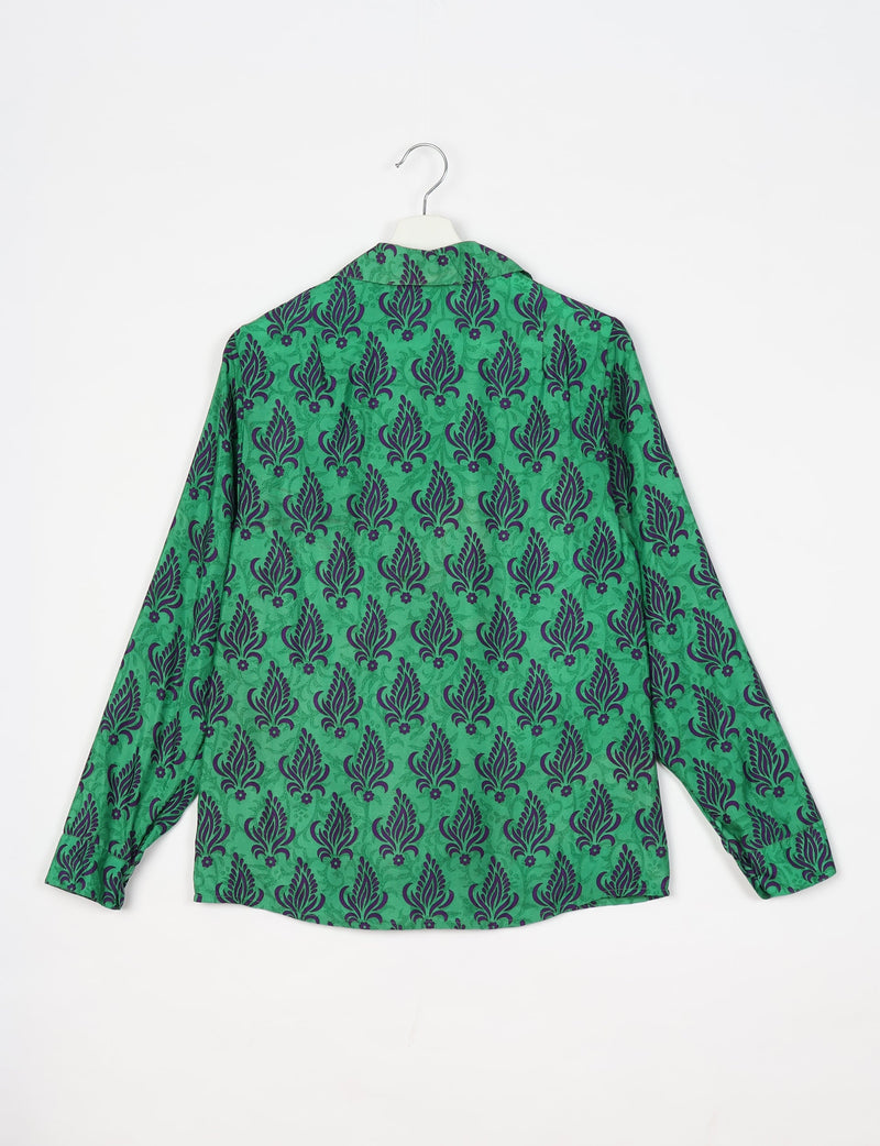 Green long-sleeve shirt with dark purple leaf and floral pattern, shown from back on white hanger against white background