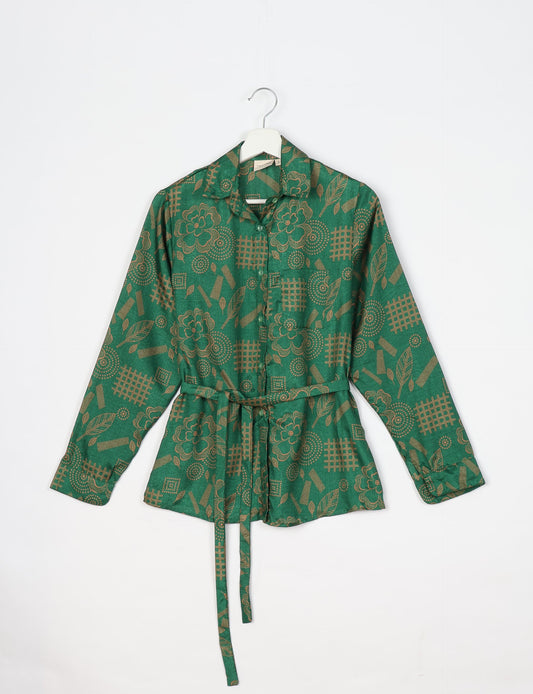 Experience sustainable fashion with our classic slim-fit shirt, crafted with ethical and green values. The shirt, designed for minimal waste, features a tie-up waist belt or neck tie, semi-spread collar, and regular shirt cuffs. Versatile and eco-friendly, wear it tucked in, unbuttoned over a tank top, or knotted at the waist for a unique style.