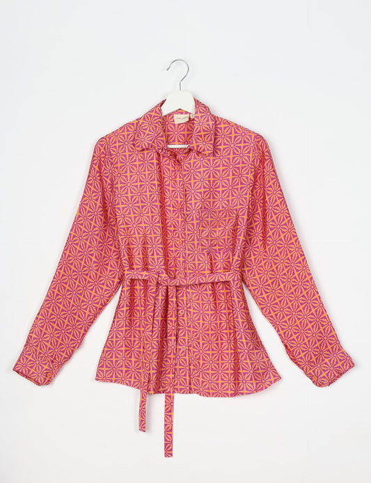 Experience sustainable fashion with our classic slim-fit shirt, crafted with ethical and green values. The shirt, designed for minimal waste, features a tie-up waist belt or neck tie, semi-spread collar, and regular shirt cuffs. Versatile and eco-friendly, wear it tucked in, unbuttoned over a tank top, or knotted at the waist for a unique style.