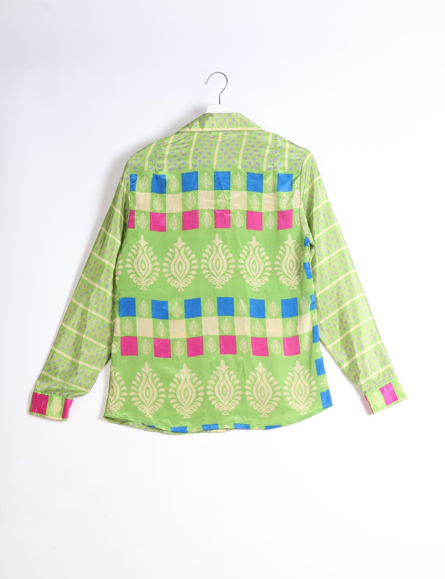 Experience sustainable fashion with our classic slim-fit shirt, crafted with ethical and green values. The shirt, designed for minimal waste, features a tie-up waist belt or neck tie, semi-spread collar, and regular shirt cuffs. Versatile and eco-friendly, wear it tucked in, unbuttoned over a tank top, or knotted at the waist for a unique style.