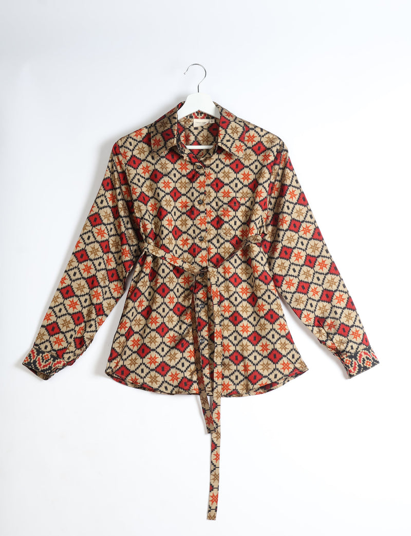 Beige geometric patterned long-sleeve shirt with collar and front buttons, displayed on a white hanger
