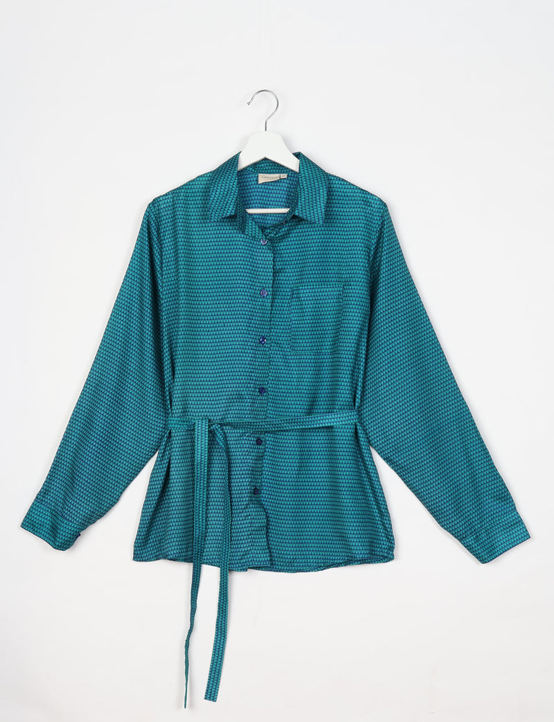Blue long-sleeve button-up shirt with micro pattern, chest pocket, collar, and matching fabric belt, hanging on white hanger