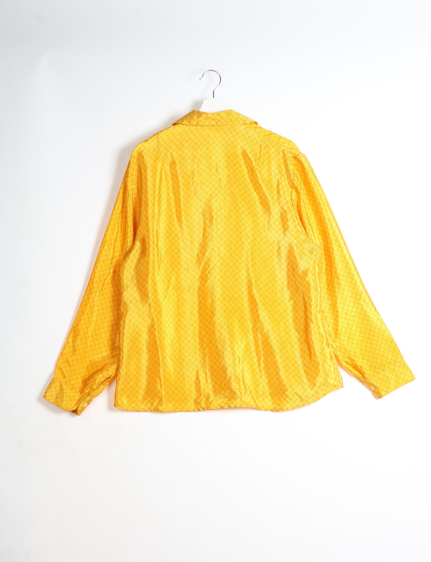 Experience sustainable fashion with our classic slim-fit shirt, crafted with ethical and green values. The shirt, designed for minimal waste, features a tie-up waist belt or neck tie, semi-spread collar, and regular shirt cuffs. Versatile and eco-friendly, wear it tucked in, unbuttoned over a tank top, or knotted at the waist for a unique style.